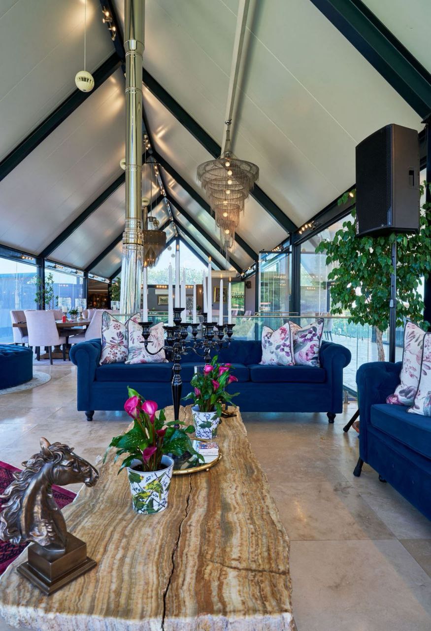 Stylish bar area with red leather stools